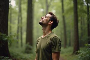 person standing looking up and enjoy the nature sense at the jungle, photo