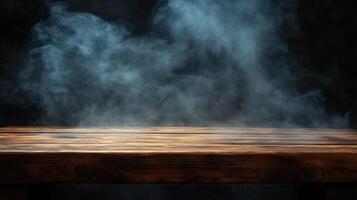 Wooden table with smoke on a dark background. photo