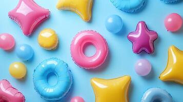 Colorful inflatable shapes floating on pastel background photo