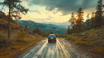 the car drives through the forest on the background of the mountains photo