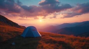 camping tent high in the mountains at sunset photo