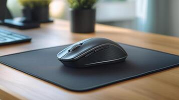 Wireless mouse with a scroll wheel on a mouse pad, ready for use photo