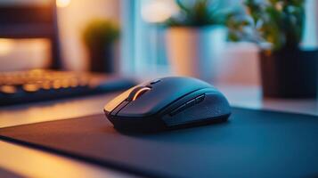 Wireless mouse with a scroll wheel on a mouse pad, ready for use photo