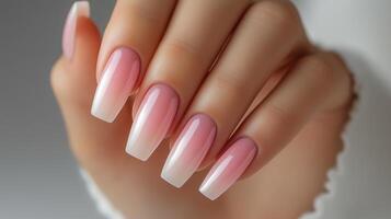 Closeup to woman hands with elegant neutral colors manicure. photo