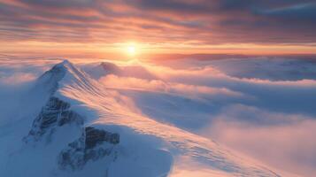 A dramatic and pristine mountaintop covered in snow photo