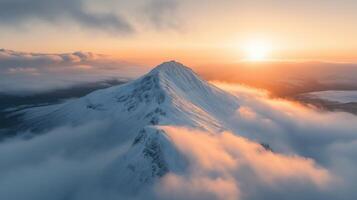 A dramatic and pristine mountaintop covered in snow photo