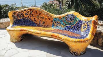 Famous Gaudis masterpiece serpent bench made of mosaic tiles photo