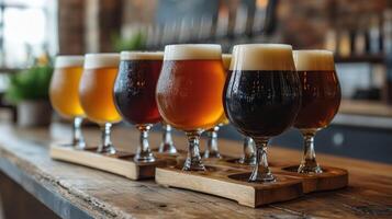 Close up of a rack of different kinds of beers, dark to light, on a table. photo