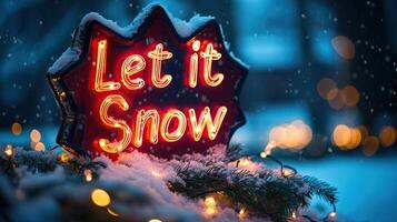 A glowing Let it Snow sign surrounded by snow and festive lights photo