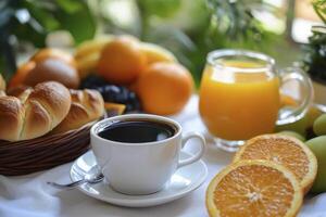 A table with a cup of coffee and oranges photo