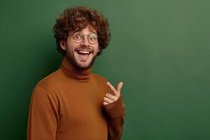 A man in glasses and a sweater is making a peace sign photo