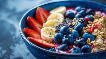 A bowl of fruit and berries with granola and granola photo