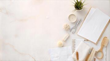 A white marble counter with a notebook, scissors, and other items photo