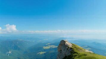 A man standing on top of a mountain photo