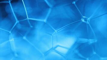 Bright reflection of liquid in macro, blue and silver colors, rainbow background, Blue bubbles in macro, connection of bubbles in macro, cell from liquid, molecules connection, ultra macro video