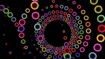 Colored balls spiral on a black background in a seamless loop. video
