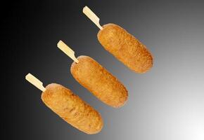 Corn dogs with different fillings and different sauces. isolated on background. photo