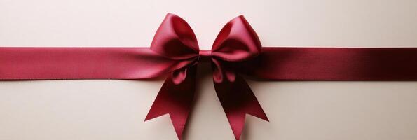 Elegant red bow adorns a velvet ribbon for gift wrapping and festive occasions photo