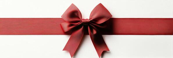 Elegant red bow adorns a velvet ribbon for gift wrapping and festive occasions photo