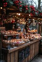 A cozy market stall adorned with holiday decorations offering a variety of baked goods at dusk photo