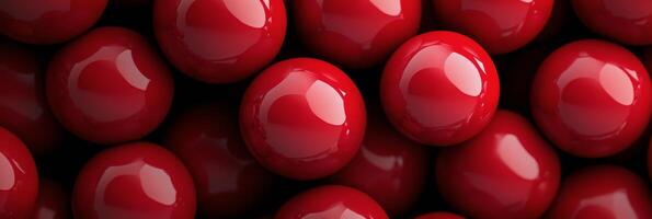 Close up view of shiny red balls arranged neatly on a flat surface during daylight photo