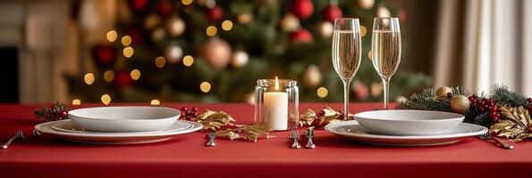 Festive Christmas dinner setting with elegant tableware, sparkling glasses, and holiday decorations photo