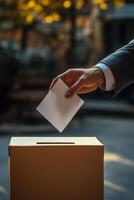 A voter casting a ballot into a donation box during a community event in an urban setting photo