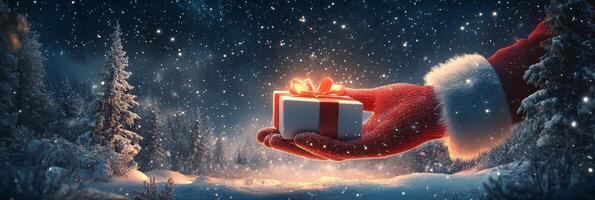 A snowy evening in the forest as Santa presents a gift with a warm glow in hand photo