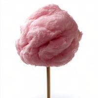 Fluffy pink cotton candy on a stick against a simple background in bright lighting photo
