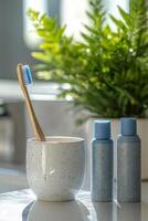 Two blue grooming tools beside a potted plant and a white bowl in a cozy bathroom setting photo