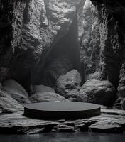 A dark, rocky canyon with a circular platform at the center illuminated by ambient light photo