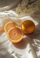 Freshly cut grapefruit on soft fabric with natural light highlighting the juicy segments photo