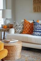 Bright and cozy living room with colorful pillows on a light sofa and a wicker coffee table photo