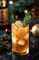 Sparkling holiday cocktail with apple and rosemary garnished by festive decorations photo
