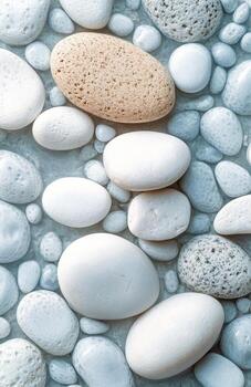 Beautiful arrangement of smooth white stones on a textured light background in minimalist style photo