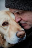 A man gently embraces his loyal Labrador in a moment of tenderness during a chilly afternoon photo