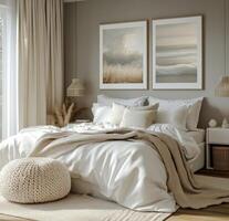 Cozy bedroom featuring soft bedding and peaceful artwork in a serene, neutral toned setting photo