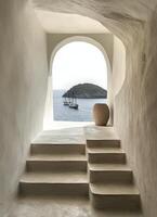 A beautiful coastal view through an archway on a sunny day with boats in the distance photo