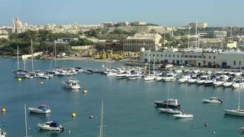 Time lapse of the harbour of Valetta on Malta with many yachts and boats in the sunshine. video