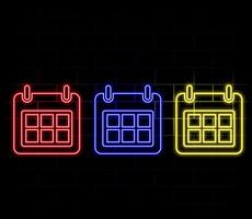 Glowing neon Calendar icon isolated on brick wall background. Event reminder symbol. vector