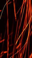 Long shining sparkles flying in changing direction. Beautiful bright scintilla moving quickly at black backdrop. Vertical video