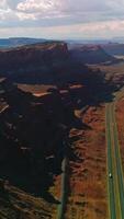 Sunlit cliffs and rocks of Zion National park at daytime. Amazing scenery of deserted territory from top view. Vertical video