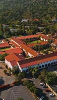 Rich luxurious mansions with beautiful buildings and nature around. Sunny picture of amazing Santa Barbara from aerial view. Vertical video