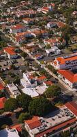 Splendid view of Santa Barbara architecture. Beautiful dwellings in the greenery and neat streets from aerial perspective. Vertical video