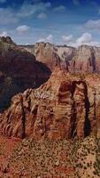 Impressive view of stunning rocks in Zion National Park in Utah, USA. Amazing canyons At the backdrop of bright cloudy sky. Vertical video