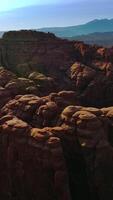 Weird rocks with rounded tops in Arches canyon, Utah, USA. Splendid view on the numerous rocks in national park. Top view. Vertical video
