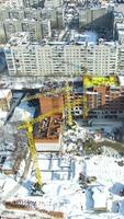 Construction site with cranes. Under construction high-rise building with construction cranes video