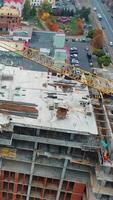 Drone shot of busy construction site. Aerial drone view of construction project in city video