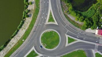 Circular Movement At The Traffic Intersection. Aerial view of roundabout in the city in the summer in Ukraine video