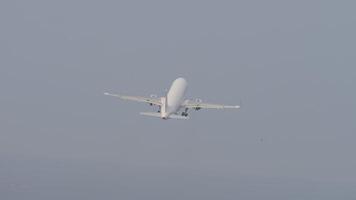 Unknown aircraft take off, landing gear retracted and climbed, long shot, rear view video